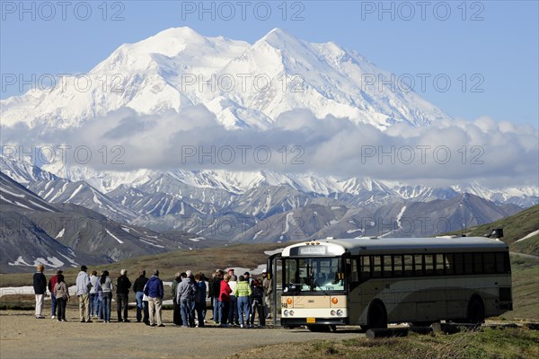 The Wilderness Tour Bus of the Denali National Park and Preserve is stopping at the Stony Hill observation point with views of Mt McKinley