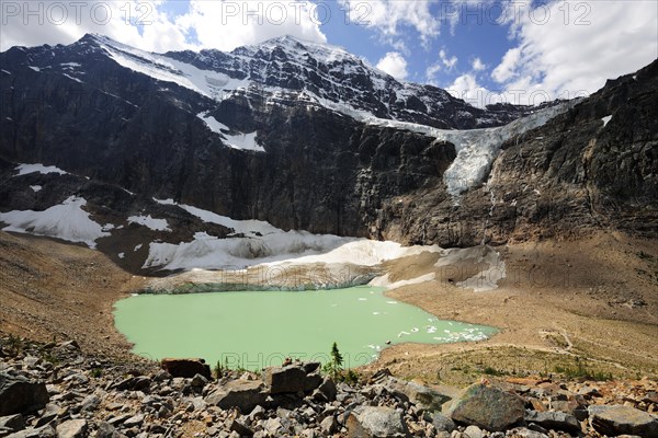 Emerald-green glacial lake with Angel Glacier and Mount Edith Cavell