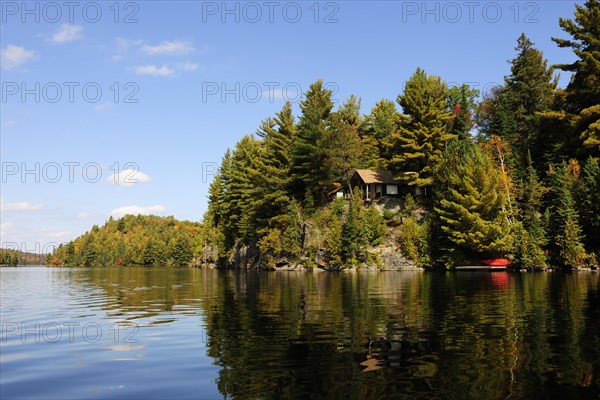 House on a rock surrounded by woods