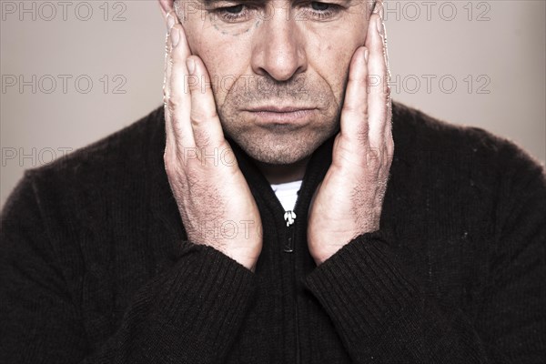 Man with markings for plastic surgery under his eye