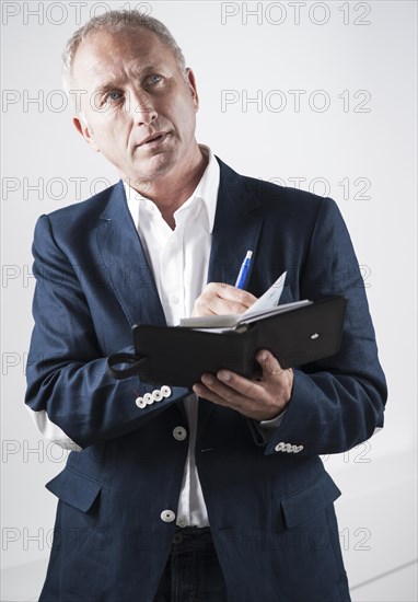 Businessman holding an appointment calendar