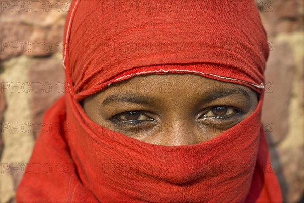 Young indian woman with a red veil