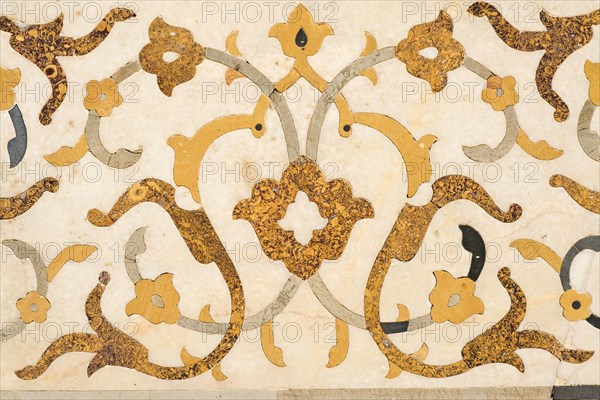 Intricate marble inlay of an Islamic mausoleum