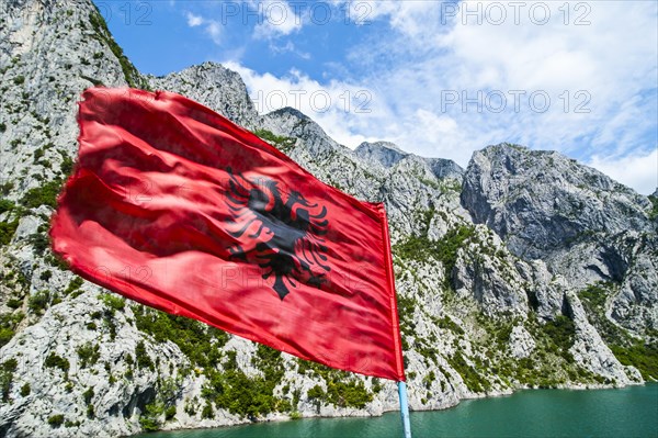 Albanian flag on the Koman water reservoir