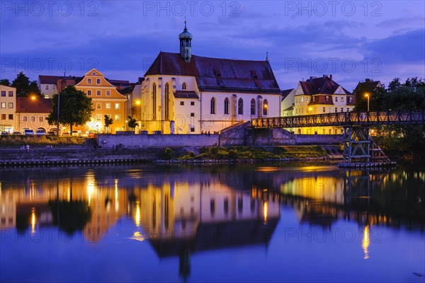 Church St. Oswald and Iron Bridge over the Danube at dusk