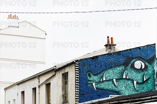 Painted house wall with crocodile figure