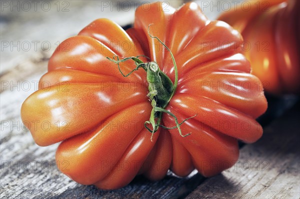 Oxheart tomato on a wooden board
