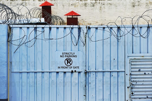 Iron gate with barbed wire