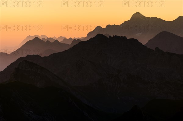 Sunrise above the peaks of the Allgau Alps in steplike arrangement