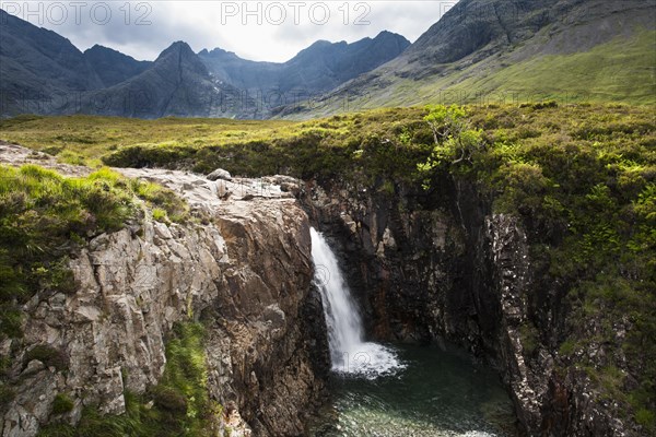 Waterfall at the Fairy Pools in Glen Brittle with Cuillin Hills behind