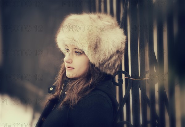 Young woman wearing a fur hat