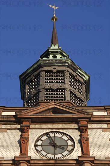 Clock tower with insulators of former telegraph poles