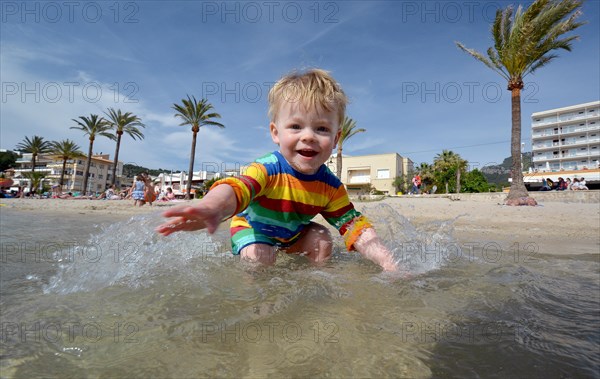 Toddler playing at the beach