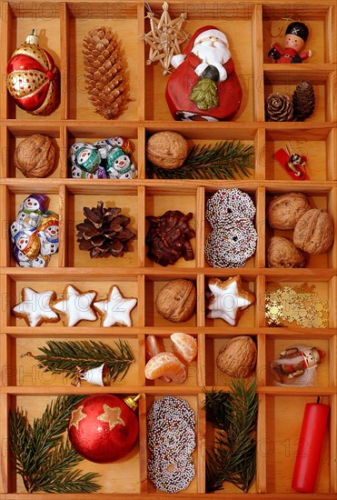 Christmas decorations and sweets in a type case or letter case