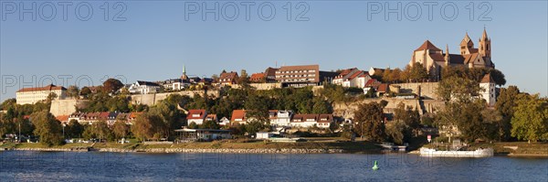 View across river Rhine to the Munsterberg hill with St. Stephansmunster cathedral