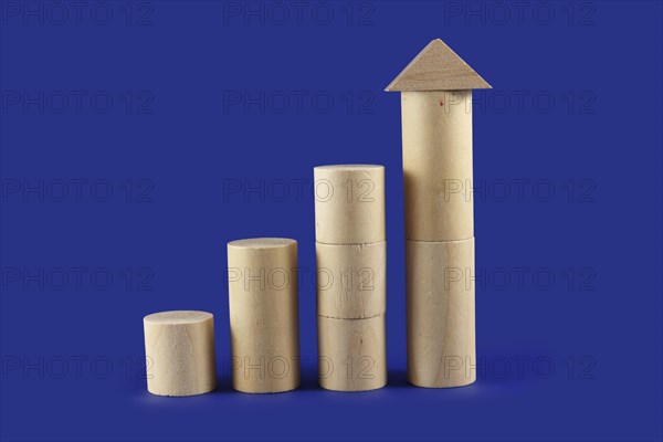 Four towers of round wooden building blocks