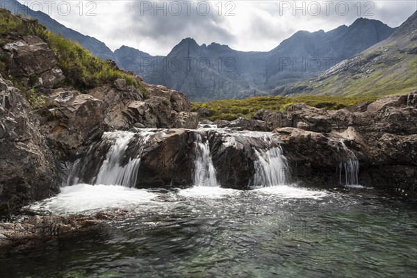Waterfall at the Fairy Pools in Glen Brittle with Cuillin Hills behind