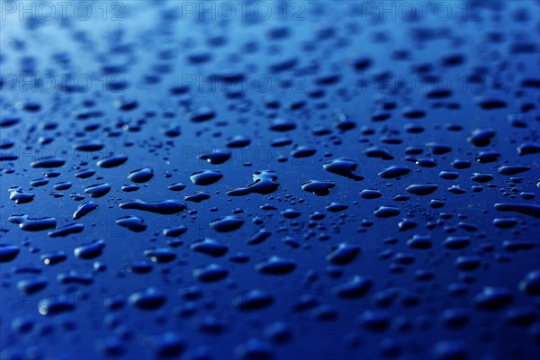 Raindrops on a car roof