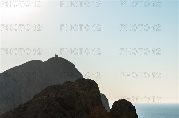 Genoese tower on a mountain on the coast