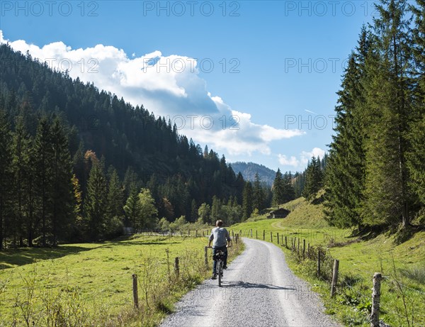 Young man riding a bicycle