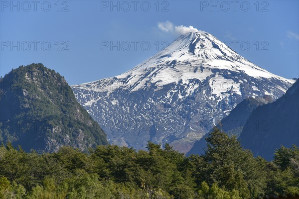 Smoking and snow-covered volcano Villarrica