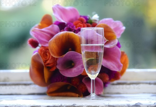 Bridal bouquet and champagne glass