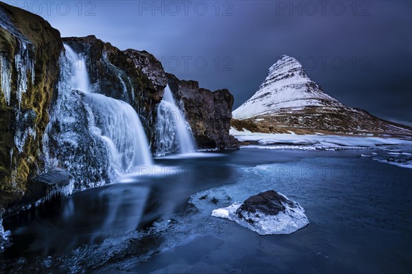 Peak of Kirkjufell with waterfall