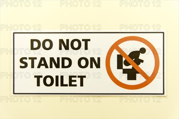 Prohibition sign 'do not stand on toilet'