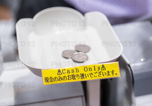 Money on cash register