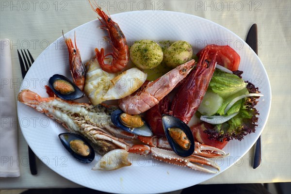 Typical fish dish with shrimps