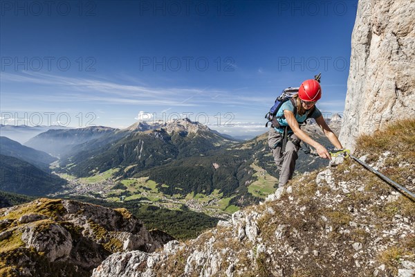 Mountaineer during the ascent to Cima Valacia on the Via Ferrata F. Gadotti in the Val San Nicolo di Fassa