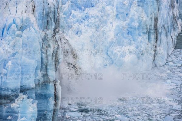 Ice breaking off the glacier wall