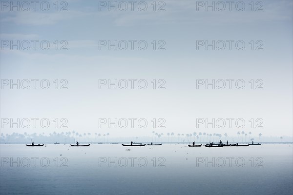 Cockle pickers with their boats