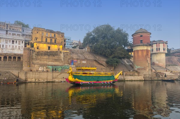 Red water tower on the Ganges riverbank