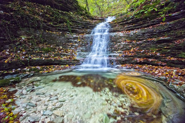 Waterfall in the forest in autumn