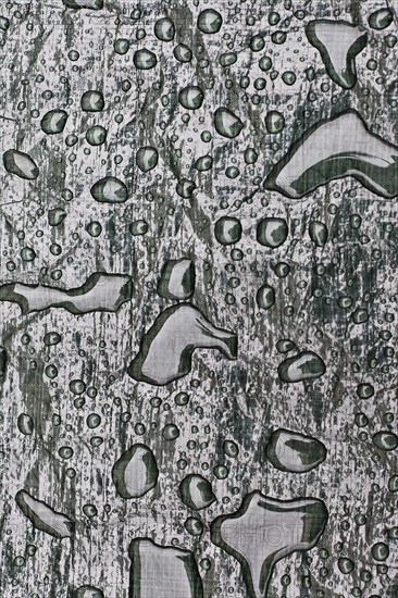 Water drops on tarpaulin