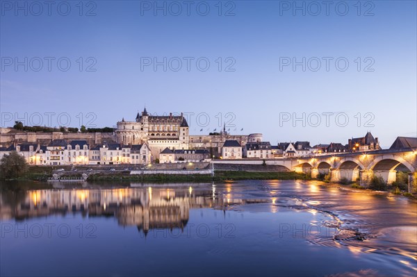 The walled town and Chateau of Amboise reflected in the River Loire in the evening