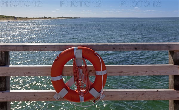 Lifebuoy on a wooden railing