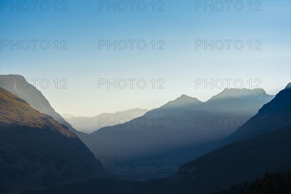 Panorama on a foggy dawn from the Mont-Cenis lake