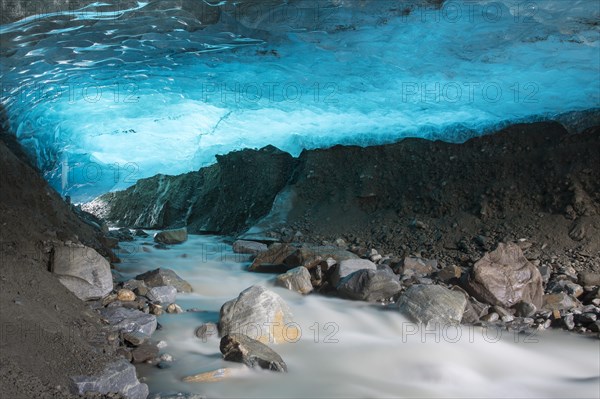 Glacier cave with a stream