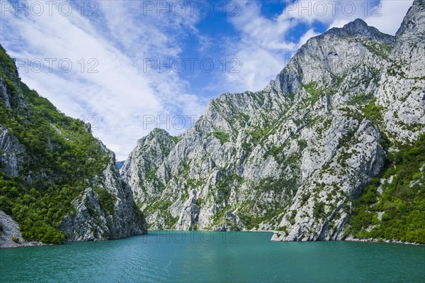 Sheer cliffs in the Koman water reservoir