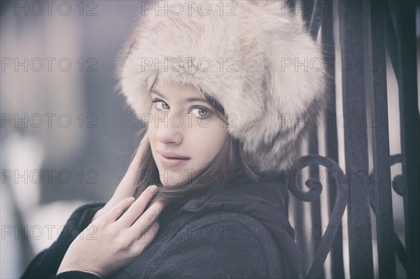 Young woman wearing a fur hat