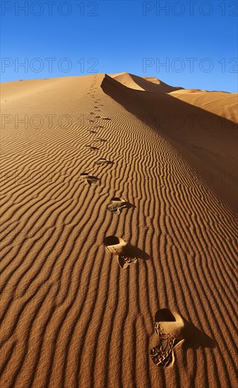 Footsteps in the Sahara sand dunes of Erg Chebbi