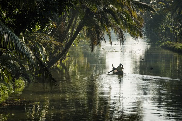 Man in a small wooden boat