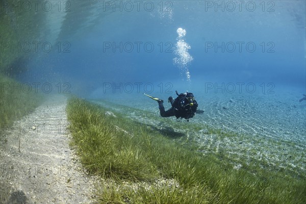 Diver next to the flooded trail