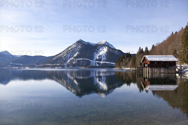 Walchensee or Lake Walchen and Herzogstand mountain in winter