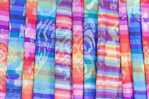 Colourful textiles on display for sale