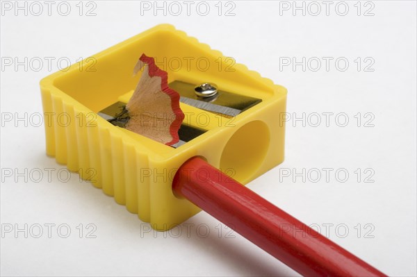 Red pencil and yellow pencil sharpener