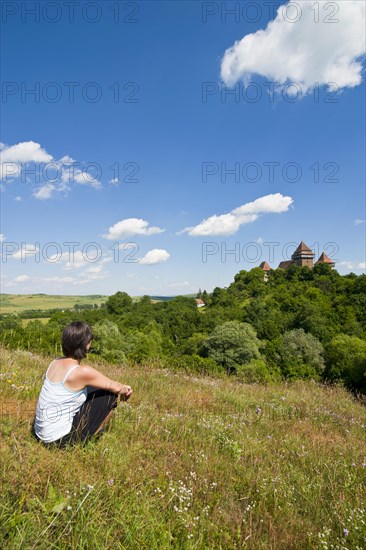 Woman looking at the fortified Saxonian church