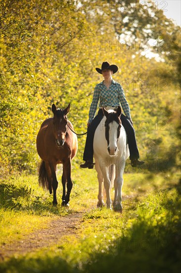 Female western rider on a Paint Horse